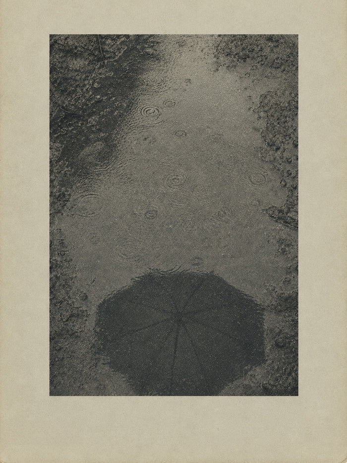 No Need to Come By, the house’s card: an umbrella on a wet path